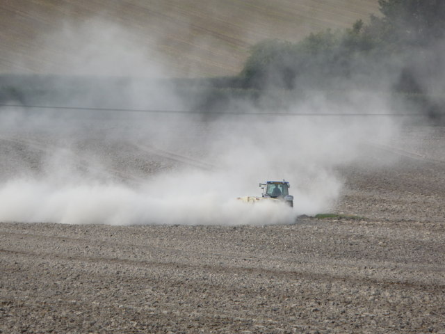 Farmer applying lime